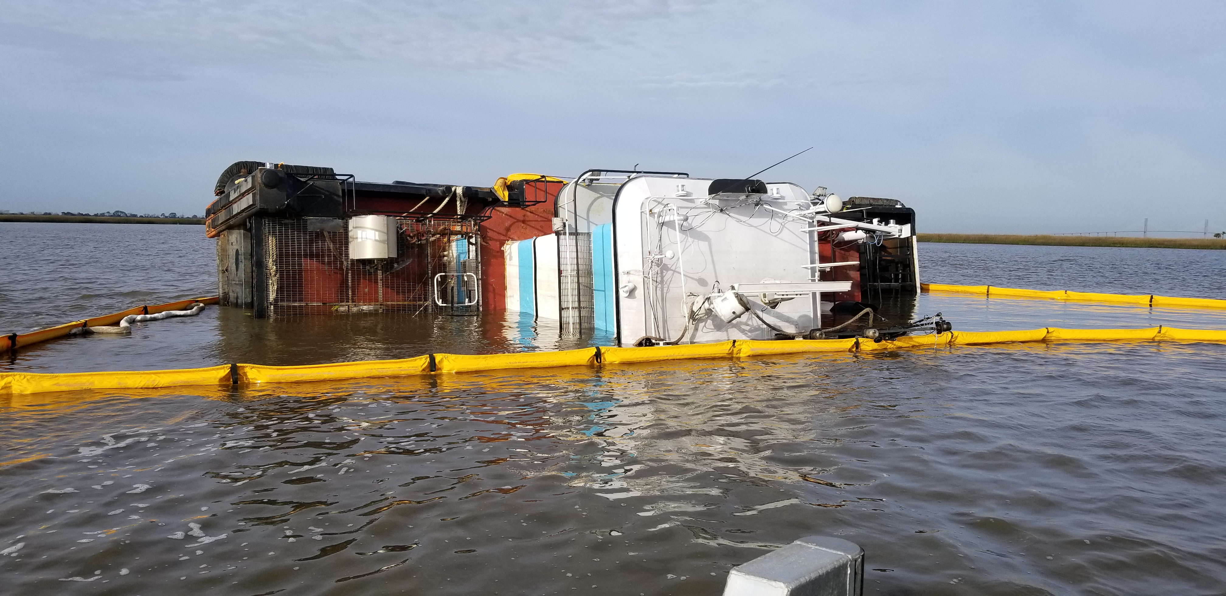 The Miss Addison, a 56-foot tug boat, is overturned on its port side in Jekyll Creek west of Jekyll Island, Ga., on Thursday, Jan. 3, 2019. Sam LaBarba/Georgia Department of Natural Resources.