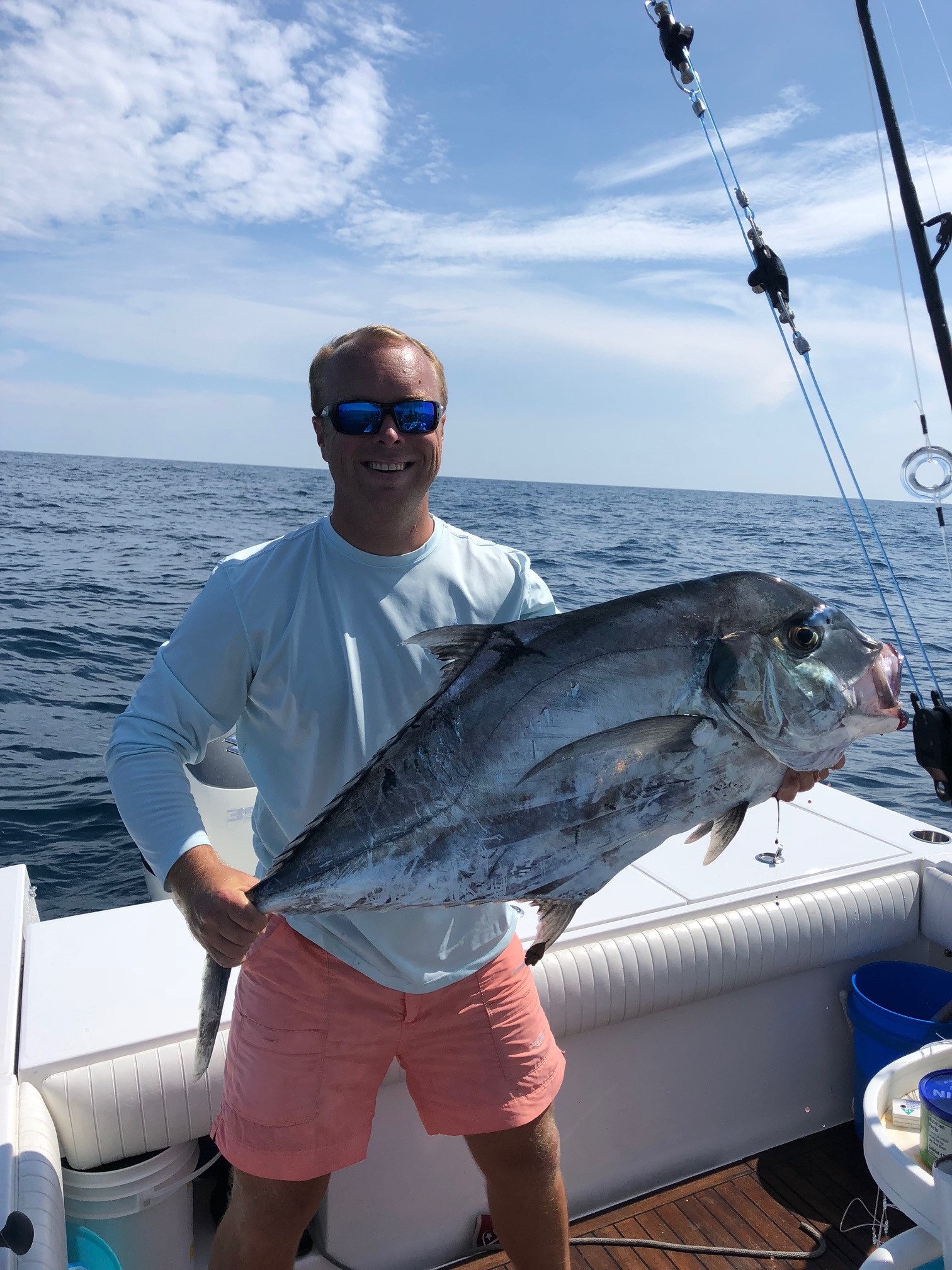 Mike McCullough holds a 23-pound, 14.4-ounce African pompano.