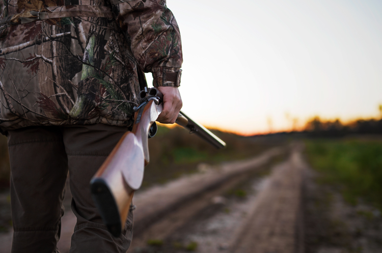 Hunter Holding Gun