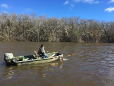 Biologist in boat