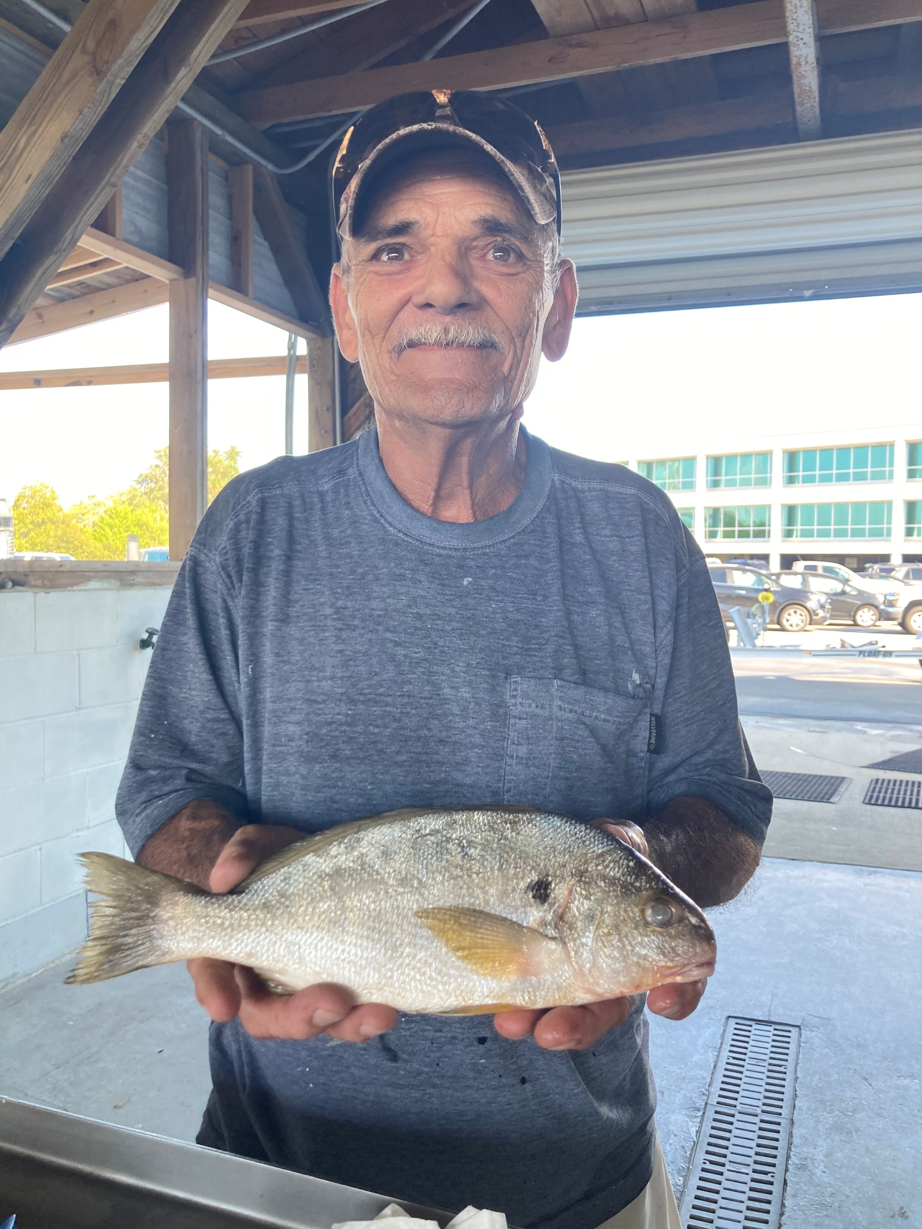 Joel E. Duck with record-setting spot fish. 