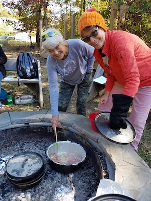 Women cooking outdoors