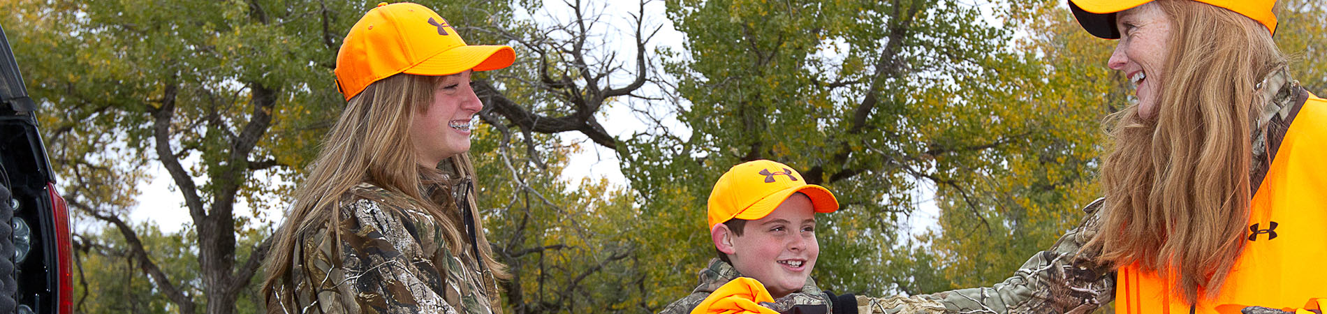 Mom Handing Daughter Orange Safety Vest