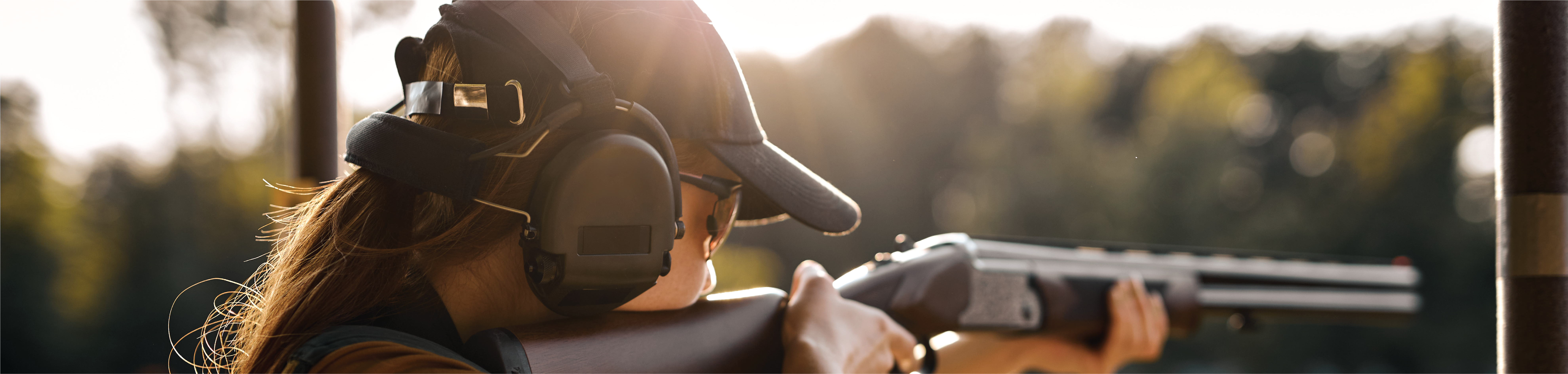 Woman Holding a gun and aiming.