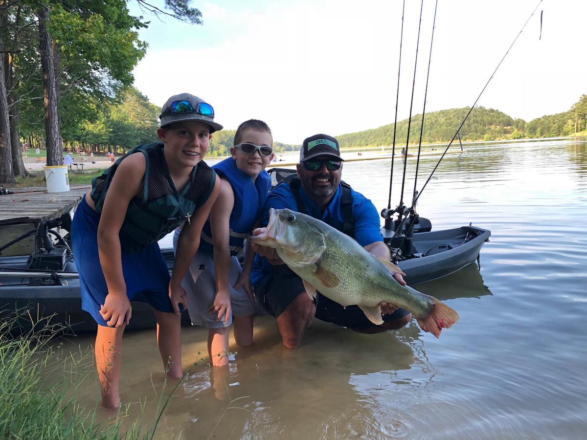 Kids and Dad Holding Largemouth Bass